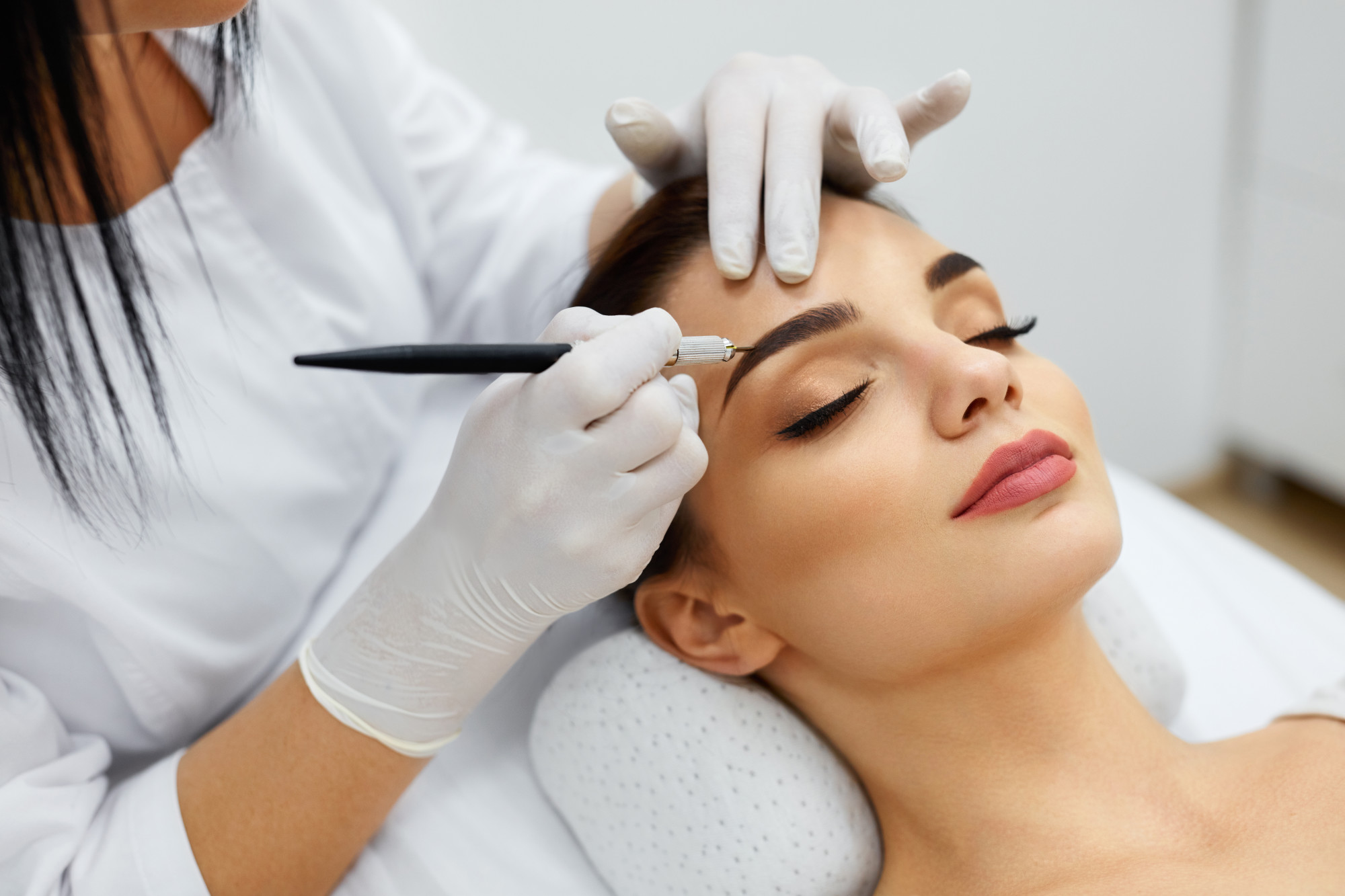 Woman Getting Eyebrows Microblading